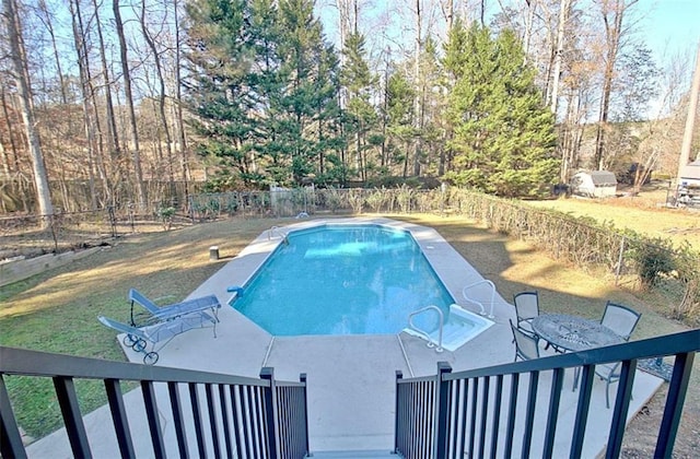 view of swimming pool featuring a patio