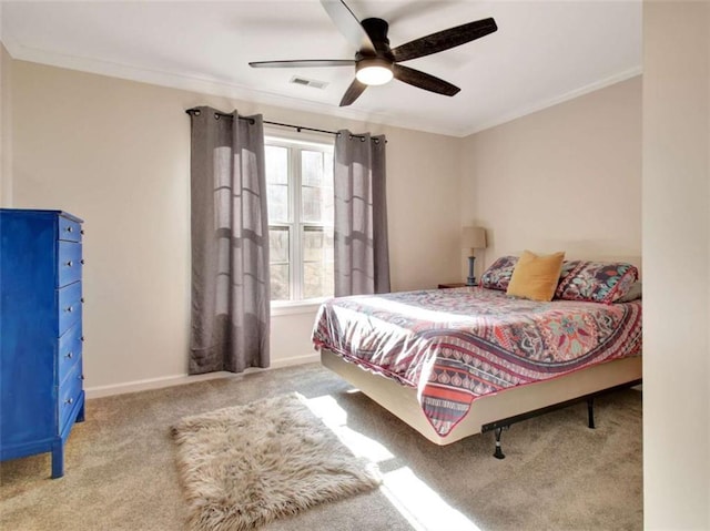 carpeted bedroom featuring crown molding and ceiling fan