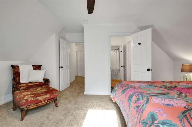 carpeted bedroom with vaulted ceiling and ceiling fan