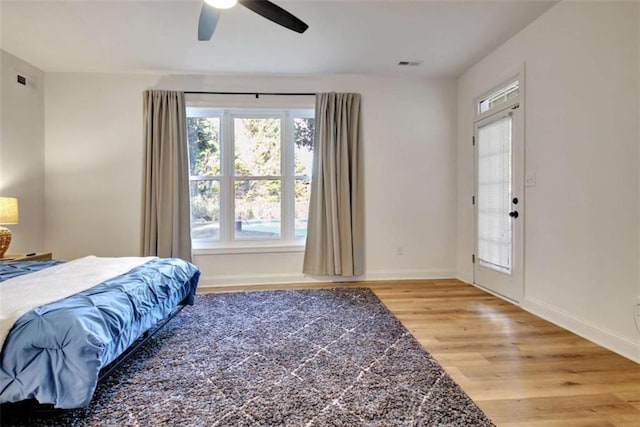 bedroom featuring hardwood / wood-style floors and ceiling fan