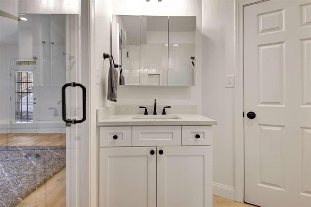 bathroom featuring vanity and walk in shower