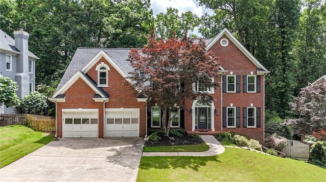 4955 Day Lily Way NW, Acworth, GA 30102 - colonial-style house with driveway and brick siding