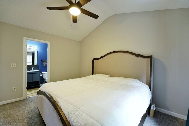bedroom with lofted ceiling, baseboards, ensuite bathroom, a ceiling fan, and carpet