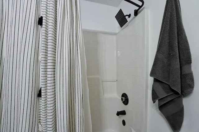 bathroom featuring shower / tub combo with curtain