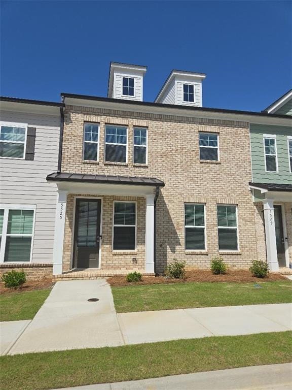 view of front of property with brick siding