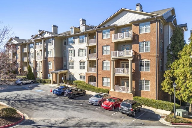 view of property featuring uncovered parking