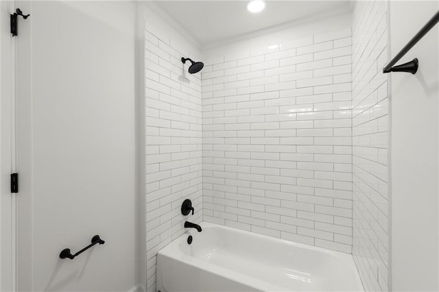 bathroom featuring  shower combination and ornamental molding