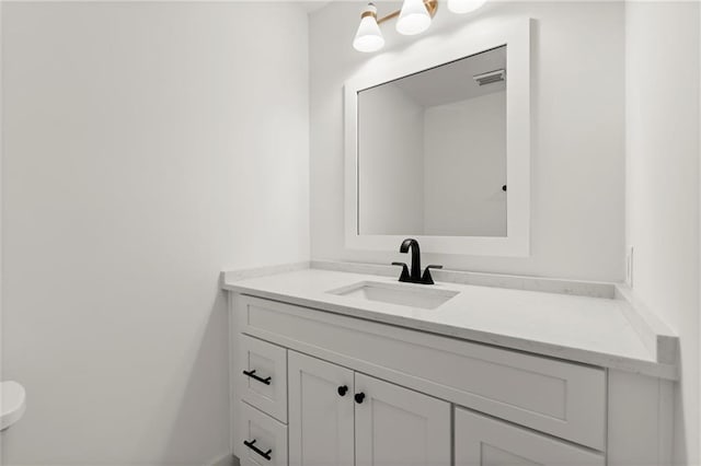 bathroom featuring visible vents and vanity