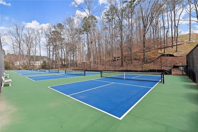 view of sport court with community basketball court and fence