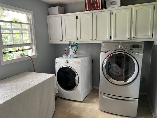 1159 Aurora Ct, Atlanta, GA 30338 - laundry room with cabinet space, washer and clothes dryer, and plenty of natural light