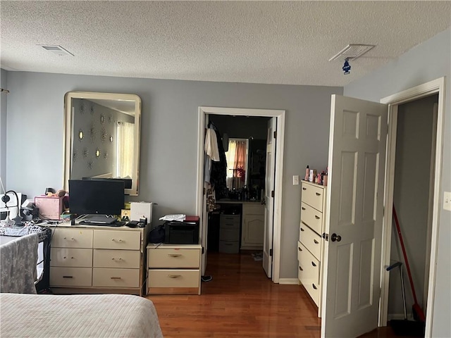 1159 Aurora Ct, Atlanta, GA 30338 - bedroom featuring wood finished floors and a textured ceiling