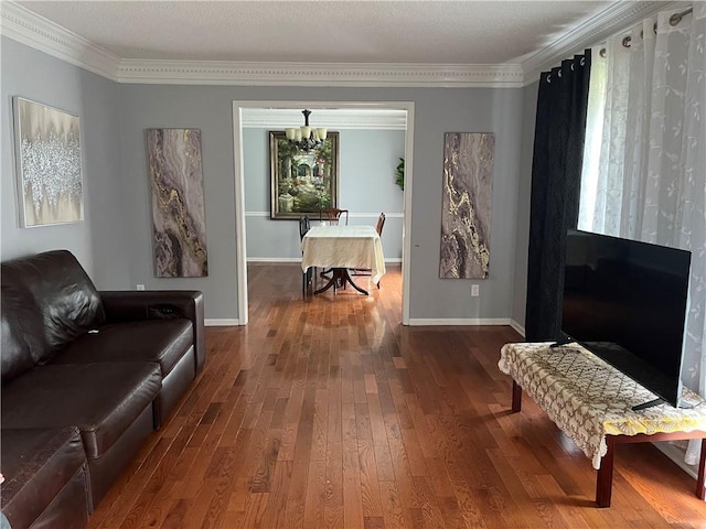 1159 Aurora Ct, Atlanta, GA 30338 - living room featuring dark wood-type flooring, crown molding, and a chandelier