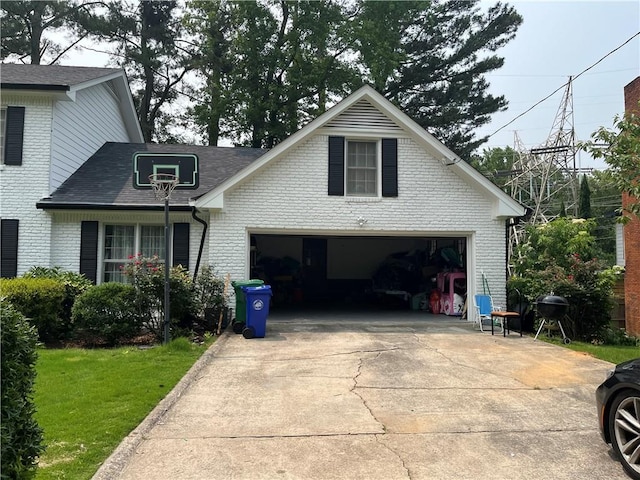 1159 Aurora Ct, Atlanta, GA 30338 - view of front of home featuring brick siding, a shingled roof, concrete driveway, and a front lawn