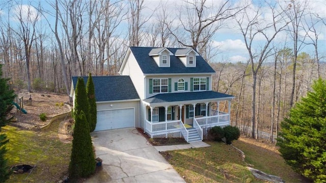 view of front of home featuring a porch and a garage