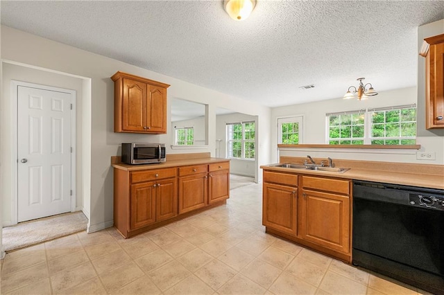 85 Old Gettysburg Way, Dallas, GA 30157 - kitchen with black dishwasher, a sink, stainless steel microwave, brown cabinets, and light countertops