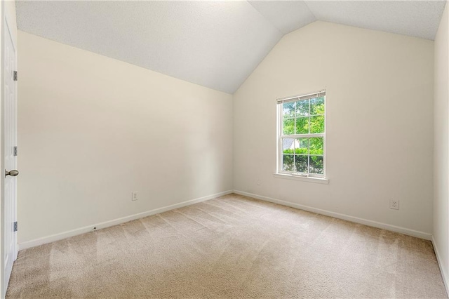 85 Old Gettysburg Way, Dallas, GA 30157 - empty room with vaulted ceiling, light colored carpet, and baseboards