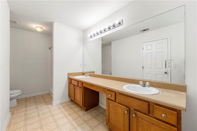 85 Old Gettysburg Way, Dallas, GA 30157 - bathroom with toilet, double vanity, tile patterned floors, a shower, and baseboards