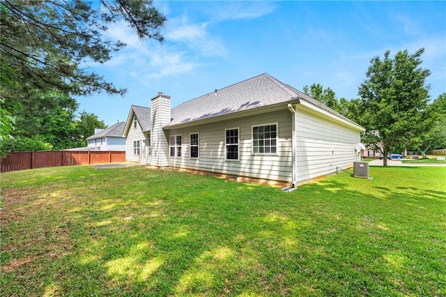 85 Old Gettysburg Way, Dallas, GA 30157 - rear view of house with central AC and a chimney