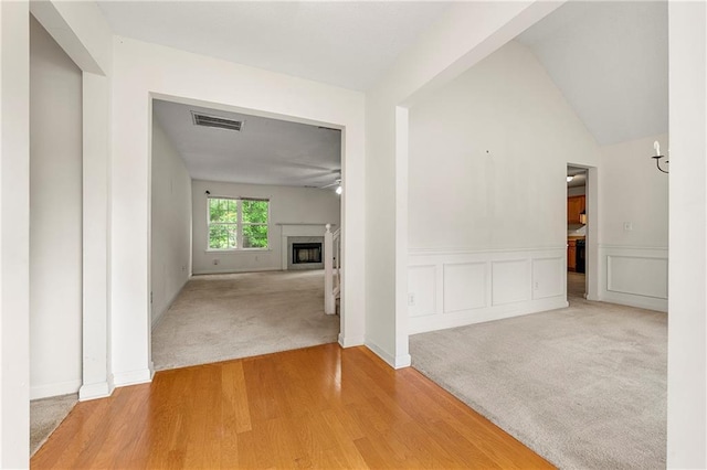 85 Old Gettysburg Way, Dallas, GA 30157 - corridor featuring light colored carpet, wainscoting, and light wood finished floors