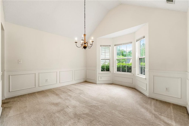85 Old Gettysburg Way, Dallas, GA 30157 - empty room with a chandelier, a decorative wall, lofted ceiling, a wainscoted wall, and carpet