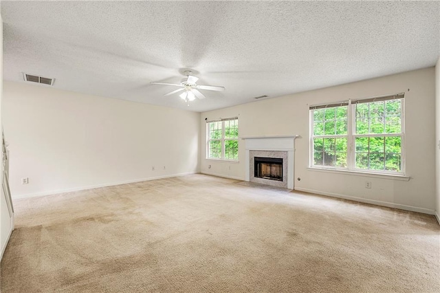 85 Old Gettysburg Way, Dallas, GA 30157 - unfurnished living room featuring ceiling fan, a fireplace, carpet floors, a textured ceiling, and baseboards