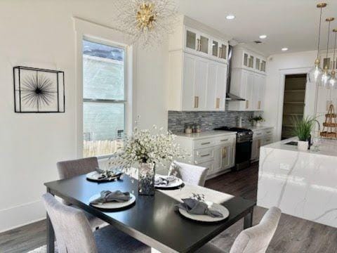 dining area featuring dark wood-type flooring and sink