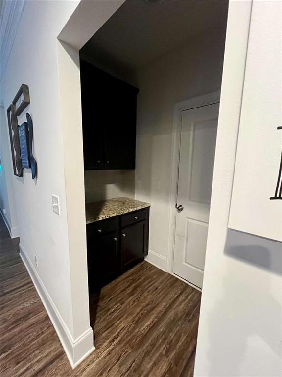 2208 Ginger Lake Dr NE, Conyers, GA 30013 - bar area with dark wood finished floors