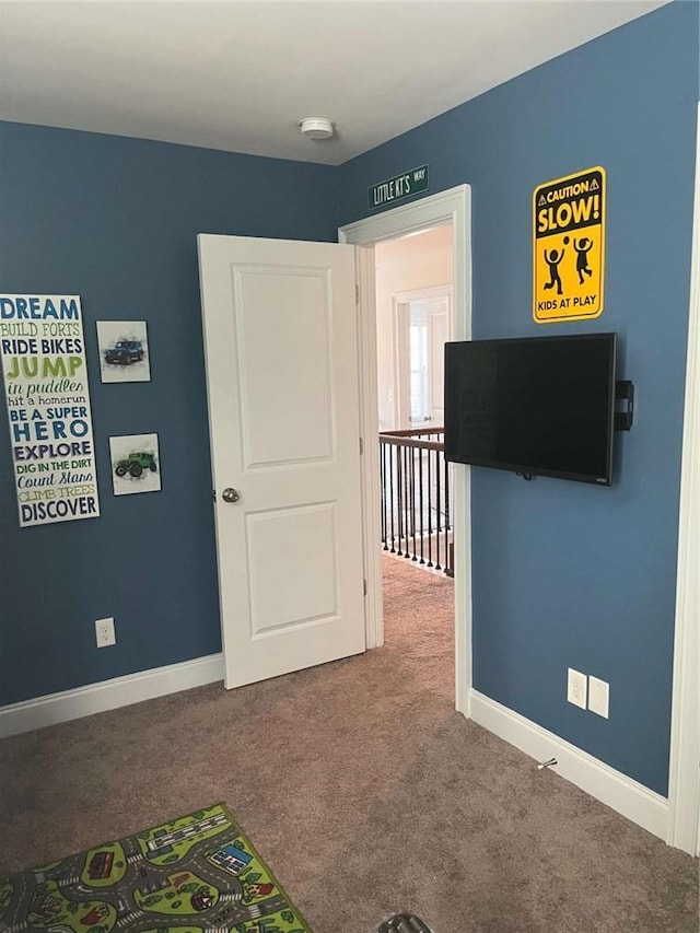 2208 Ginger Lake Dr NE, Conyers, GA 30013 - unfurnished bedroom featuring carpet and baseboards