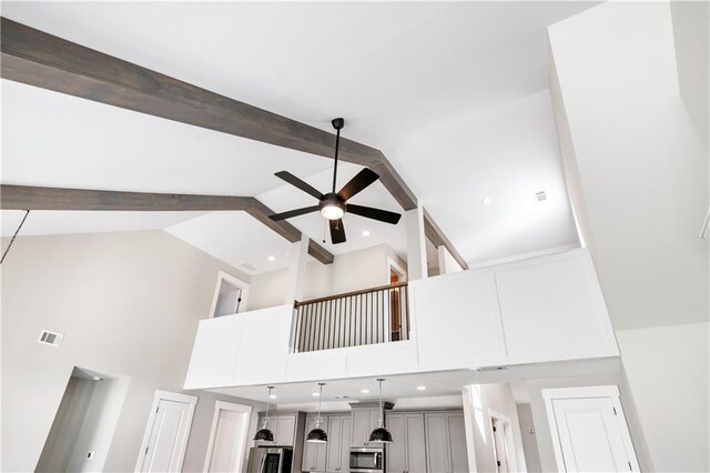 details featuring refrigerator, ceiling fan, and beamed ceiling