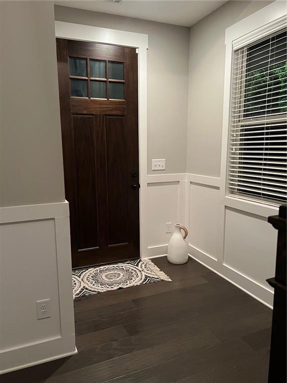 entrance foyer with dark hardwood / wood-style flooring