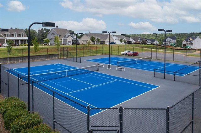 view of sport court featuring basketball hoop