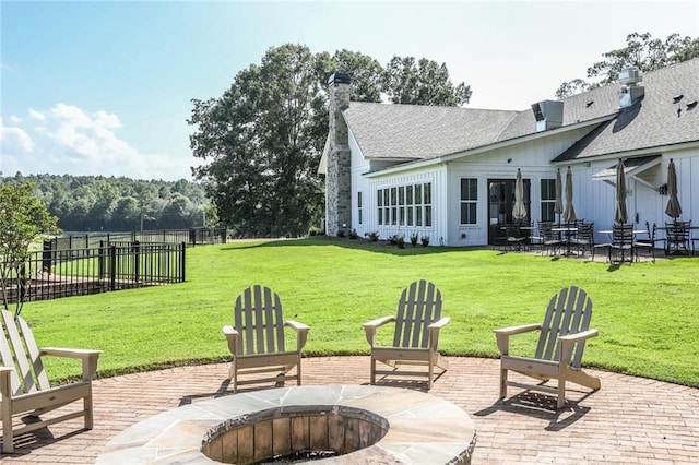 view of patio / terrace featuring an outdoor fire pit