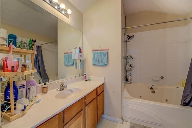 bathroom featuring tile patterned flooring, vanity, shower / tub combo with curtain, and lofted ceiling