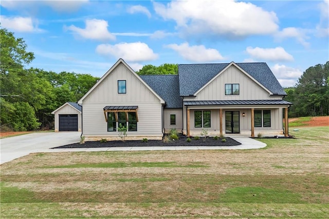 3601 Perry Smith Rd, Monroe, GA 30656 - modern farmhouse with a front yard, a standing seam roof, a shingled roof, board and batten siding, and metal roof