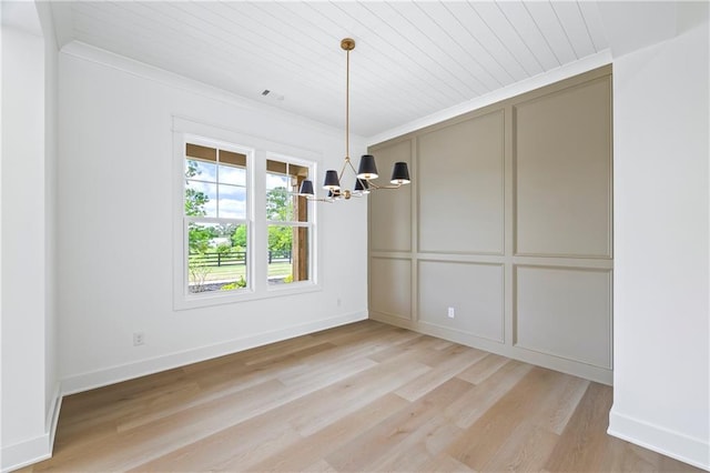 3601 Perry Smith Rd, Monroe, GA 30656 - unfurnished dining area featuring an inviting chandelier, light wood-style floors, baseboards, visible vents, and wood ceiling