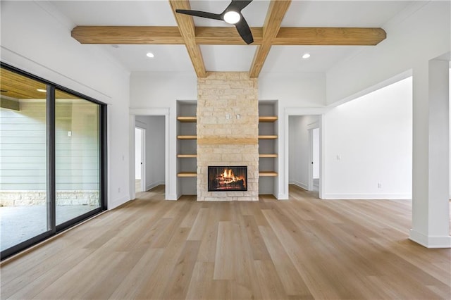 3601 Perry Smith Rd, Monroe, GA 30656 - unfurnished living room featuring ceiling fan, beam ceiling, a fireplace, baseboards, and light wood-type flooring
