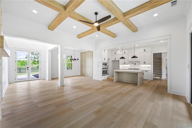 3601 Perry Smith Rd, Monroe, GA 30656 - unfurnished living room with visible vents, recessed lighting, light wood-style flooring, a ceiling fan, and coffered ceiling