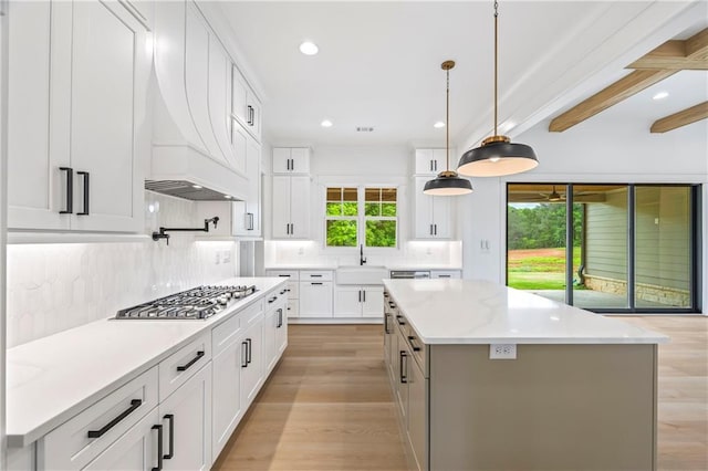 3601 Perry Smith Rd, Monroe, GA 30656 - kitchen featuring a center island, tasteful backsplash, stainless steel gas stovetop, recessed lighting, and light wood-style flooring