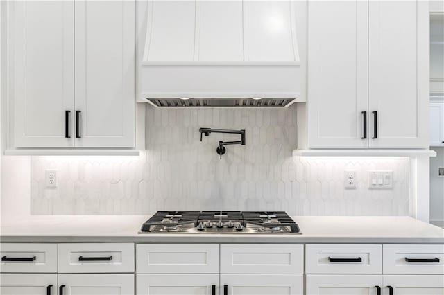 3601 Perry Smith Rd, Monroe, GA 30656 - kitchen with stainless steel gas stovetop, light countertops, and white cabinets