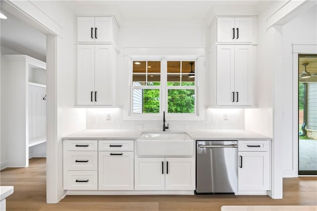 3601 Perry Smith Rd, Monroe, GA 30656 - kitchen featuring a sink, backsplash, dishwasher, and light countertops