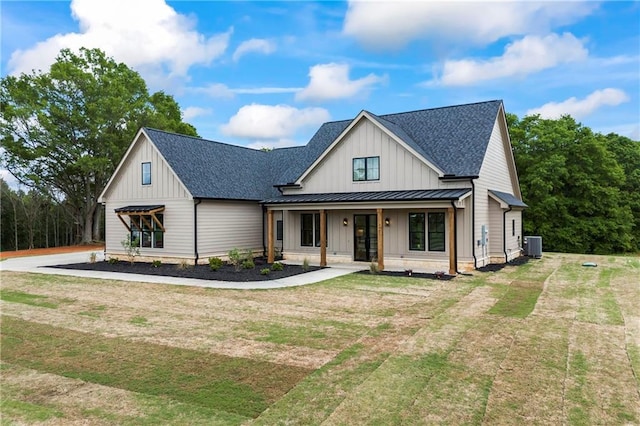 3601 Perry Smith Rd, Monroe, GA 30656 - modern farmhouse featuring covered porch, board and batten siding, a standing seam roof, roof with shingles, and cooling unit