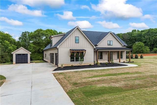 3601 Perry Smith Rd, Monroe, GA 30656 - modern farmhouse featuring an outdoor structure, covered porch, a front yard, board and batten siding, and driveway