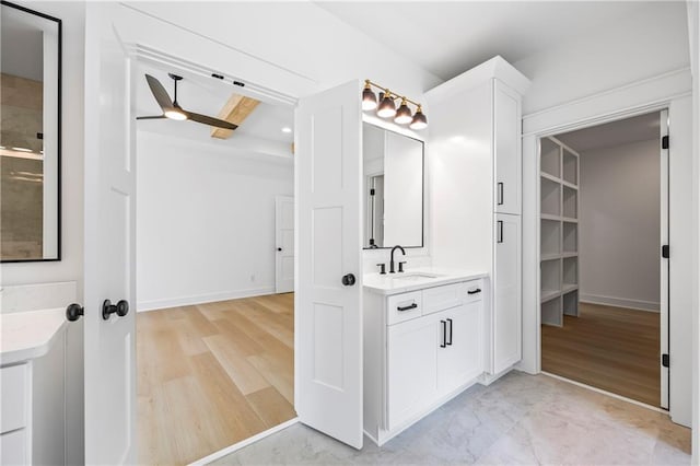 3601 Perry Smith Rd, Monroe, GA 30656 - full bath featuring vanity, ceiling fan, baseboards, and wood finished floors