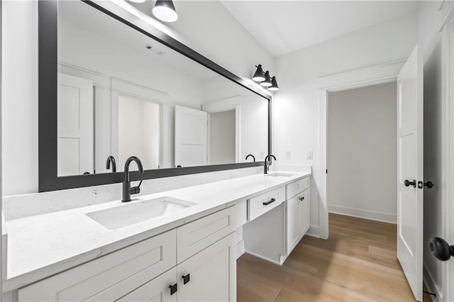 3601 Perry Smith Rd, Monroe, GA 30656 - bathroom with a sink, double vanity, and wood finished floors