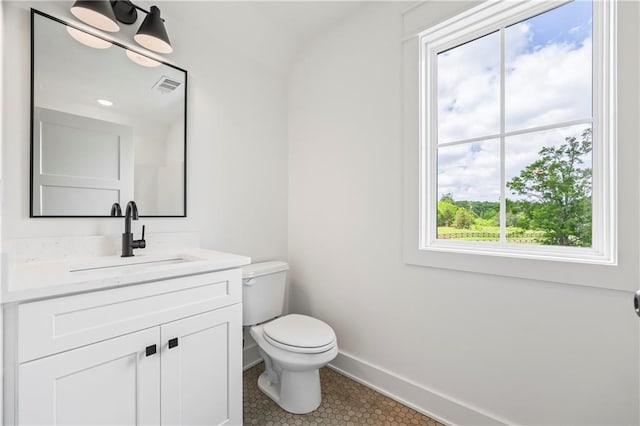 3601 Perry Smith Rd, Monroe, GA 30656 - bathroom with visible vents, tile patterned floors, baseboards, vanity, and toilet