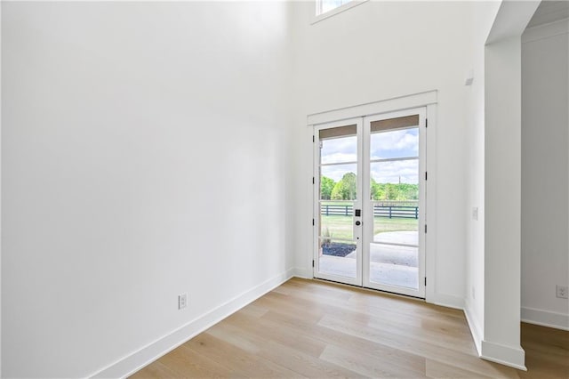 3601 Perry Smith Rd, Monroe, GA 30656 - doorway to outside with baseboards, light wood finished floors, and french doors