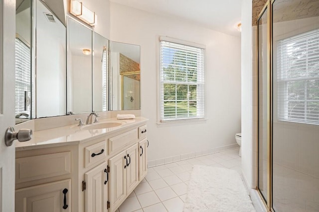 921 Laurel Crest Dr, Woodstock, GA 30189 - bathroom with vanity, tile patterned floors, toilet, and a stall shower