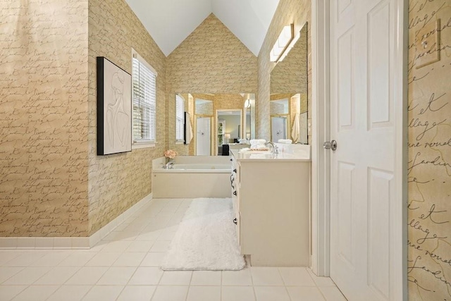 921 Laurel Crest Dr, Woodstock, GA 30189 - bathroom featuring tile patterned floors, vaulted ceiling, vanity, a garden tub, and wallpapered walls