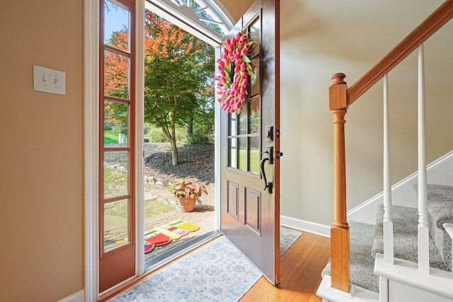 921 Laurel Crest Dr, Woodstock, GA 30189 - entryway with stairs, wood finished floors, and baseboards
