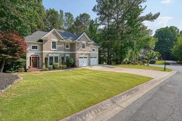 921 Laurel Crest Dr, Woodstock, GA 30189 - view of front of property featuring concrete driveway, a front lawn, a garage, and brick siding